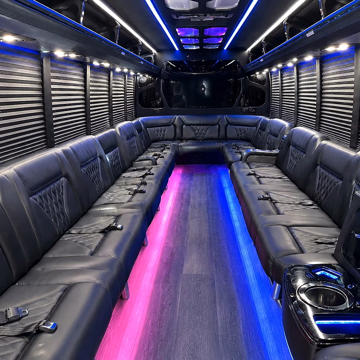 Friends laughing during a party bus celebration in Jersey City